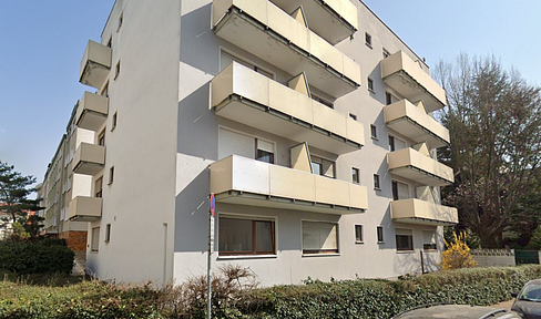 Penthouse with skyline views, terrace, and parking space – modernly renovated, ideal investment property.