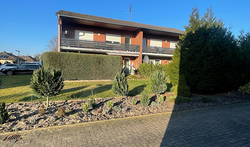 Attractive multi-family house with 4 residential units and a heat pump.