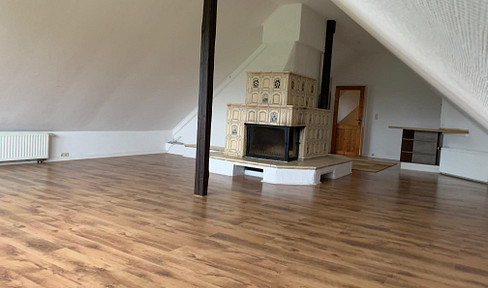 Cozy attic apartment with a fireplace, terrace, and new bathroom for rent in Sandesneben.