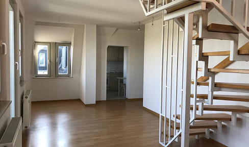 Carolastraße 32: Two-story apartment with balcony and parking space.