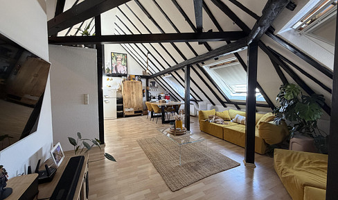 Loft-style 3.5-room maisonette apartment in the Nordend district, with a skyline view.