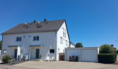 Semi-detached house with a garden.