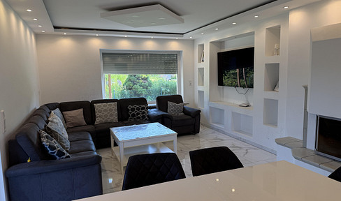 Modern 4-room ground floor apartment with a large garden, 2 terraces, and views of the countryside, located in Nordstemmen.