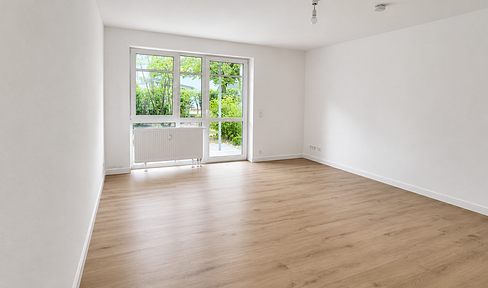 Charming, renovated apartment with a terrace, small garden, and underground parking space in Regensburg.