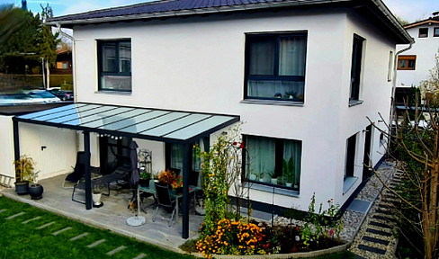 Modern city villa, solid construction, spacious layout, natural building materials.