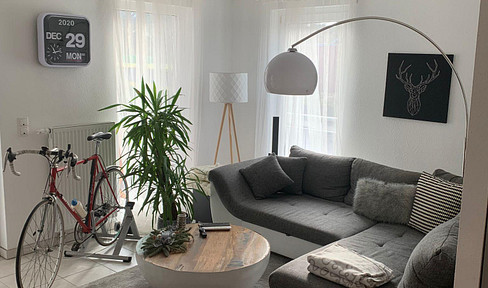 Completely renovated 2-room apartment with balcony, fitted kitchen, and parking garage in Filderstadt.