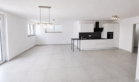 Modern 2-room apartment with fitted kitchen and parking space.