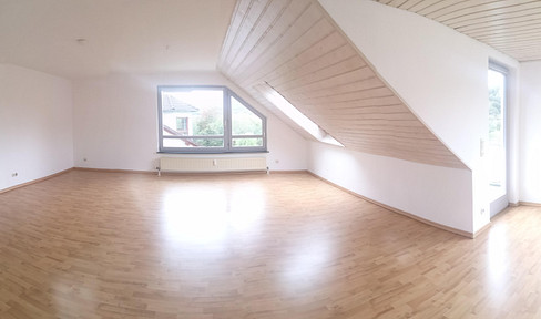 Spacious 2-bedroom apartment with a view of greenery.
