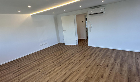 Modern living, brand new: Air-conditioned attic apartment with views of the greenery, included.