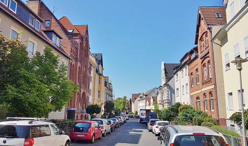 Duplex apartment with a rooftop terrace, located on a side street near the city center.