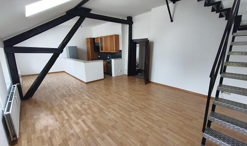 Duplex loft apartment in a historic building made of natural stone.