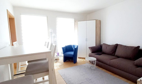 Bright, one-bedroom apartment with a modern fitted kitchen and parking space in an underground garage.
