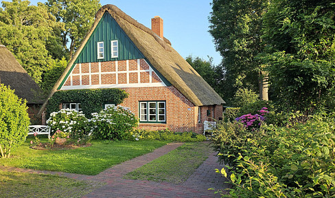 For sale by owner: Modernized historic thatched-roof house in a picturesque location.