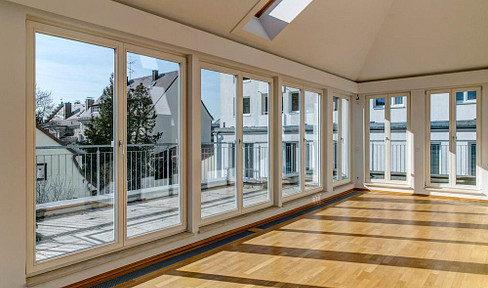 Bright, light-filled penthouse apartment with a rooftop terrace, located near the center of Munich.