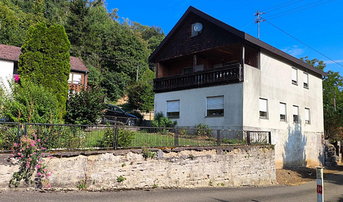 Versatile modernization project with vaulted cellar, garage, and optional fireplace, located in a natural setting.