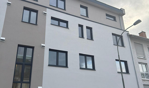 Bright, modern 3-room apartment with fitted kitchen, balcony, and guest toilet - energy efficiency class A+.