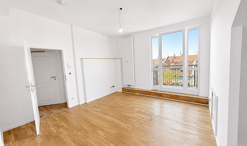 First occupancy after attic conversion: Bright 2-room apartment with fitted kitchen and balcony.