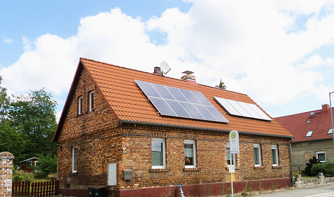 Brickwork, garden, and workshop: A home for those who love to build and create.