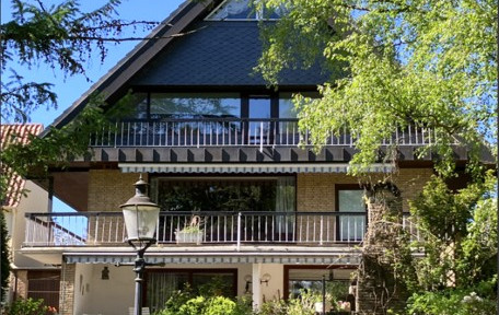 Spacious living space across three levels: An architect-designed house with a comfortable basement level and a private, enclosed garden.