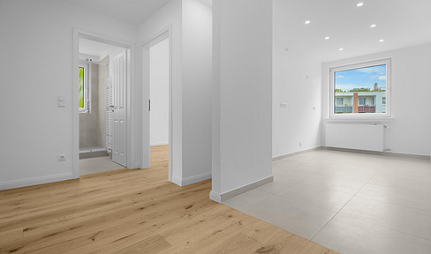 Newly renovated 3-room apartment with balcony and garage.