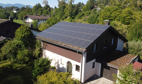 Rare find in Prien – Detached house on the Prien river, with mountain views, conservatory, and solar panels.