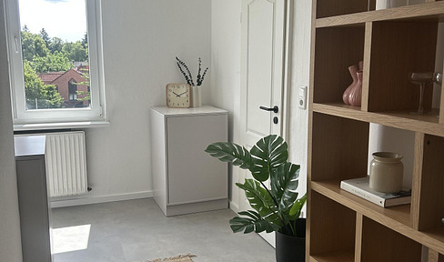 Beautifully renovated 2-room apartment with a shared garden.