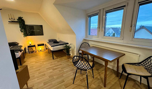 Bright 2-room penthouse apartment with fitted kitchen.