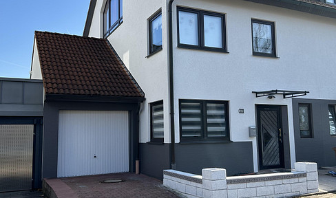 Well-maintained semi-detached house with a garden, conservatory, sauna, and spacious living areas.
