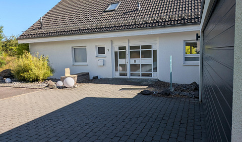Beautiful single-family home with a wellness area in the garden and solar panels on the roof. Modern living.