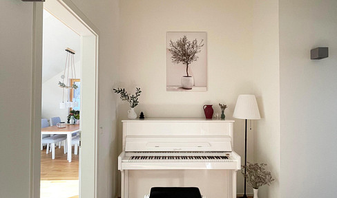 Bright and airy attic apartment with top-quality features and stunning views.