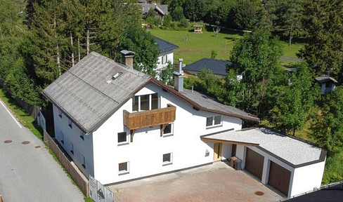 Detached house with significant development potential.