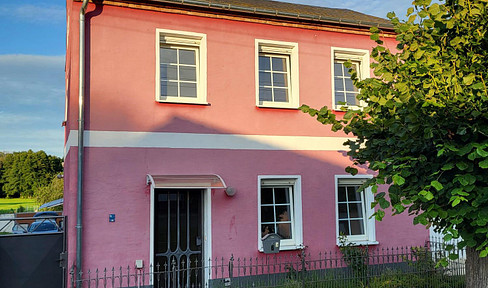 Detached house with a large plot of land.
