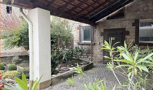 Farm, smallholding with a house, barns, open spaces, and located near farmland.