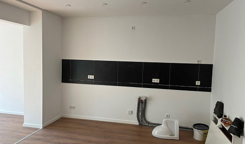 Completely renovated, light-filled apartment with a small garden.