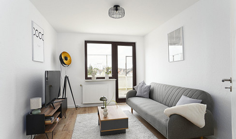Modern renovated 2-room apartment with a spacious balcony.