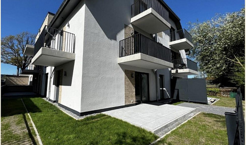 Bright 2-room apartment with a terrace, garden, and high-quality finishes.