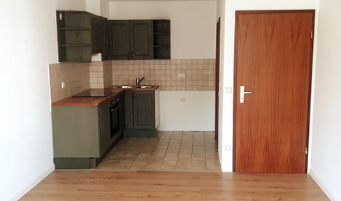 2-room apartment with balcony and underground parking space.