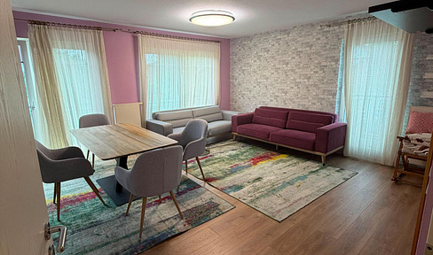 Exclusive 4-room apartment with a spacious terrace, balcony, and underground parking space, located in a prime location.