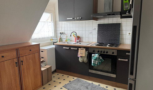 2-room attic apartment with fitted kitchen and large garden, near the university in [City Name] - Temporary lease agreement.