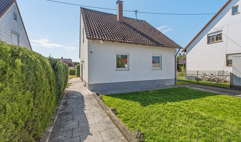 Family home with a large garden and potential.