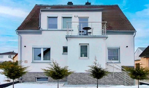 Residential building with potential for multiple living units, and a separate outbuilding, situated on a plot of approximately 1110 square meters.