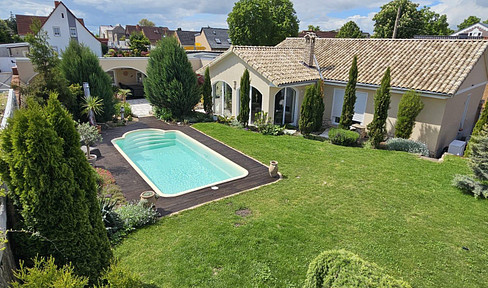 Mediterranean-style detached house, designed in a bungalow style.