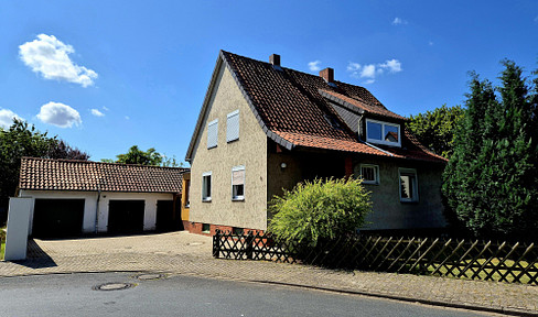 A charming village setting surrounded by greenery, close to the city yet still in the countryside.