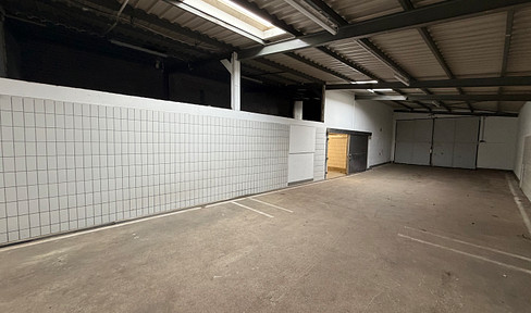 Ground-floor hall with a cold storage room, floor drain, office, toilet, and plenty of space!