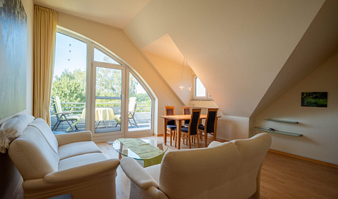 (Furnished) 2-room apartment with a view of the Neander Valley and an electric vehicle charging station in the underground parking area.