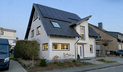 Your new home: A detached house with a swimming pool, heat pump, solar panel system, and fireplace.