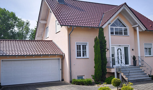 Detached single-family house with attic, located in a quiet, undeveloped area on the edge of the village.