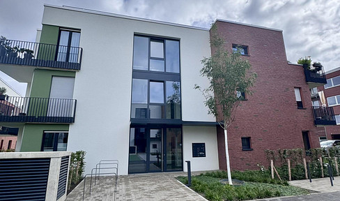 Newly built, furnished 2-room apartment with a sunny terrace and garden.
