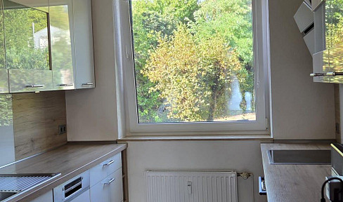 Bright 4-room apartment with balcony and garage.