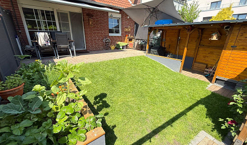 FURNISHED: Spacious 2-room ground floor apartment with a south-facing terrace and a private garden.